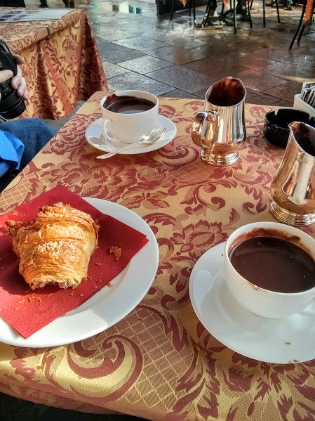 Hot chocolate and croissants on a wet day in Venice