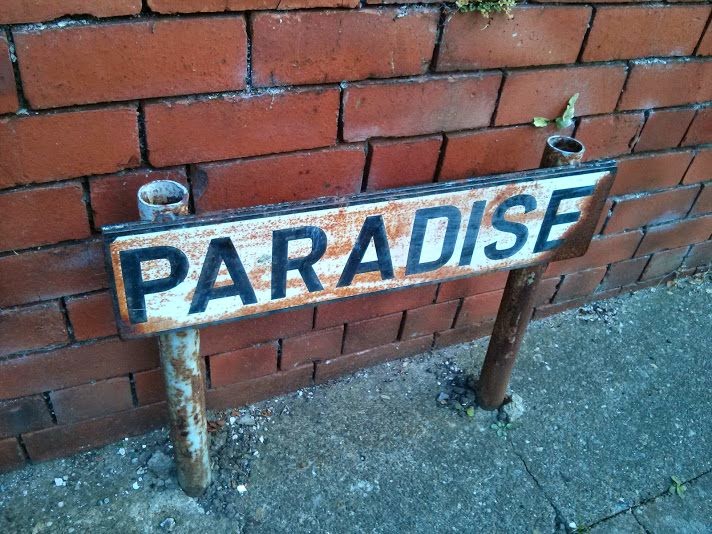 Paradise road sign