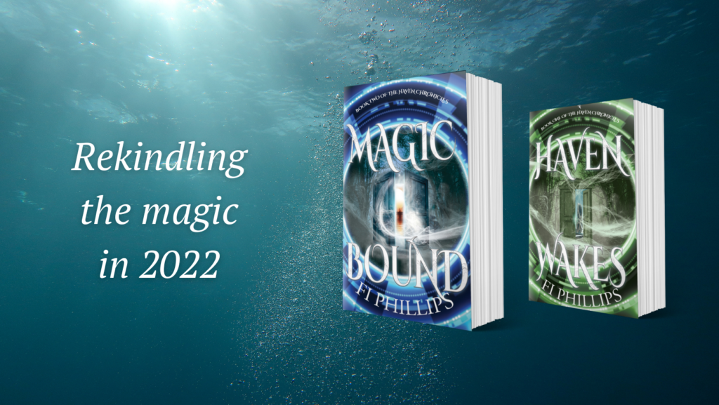 Paperback copies of Haven Wakes and Magic Bound and the world Rekindling the magic in 2022